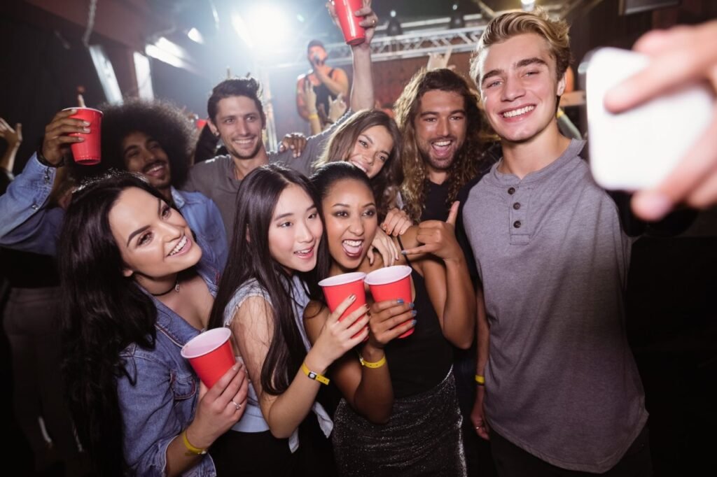 Happy Friends Taking Selfie At Music Concert 1024x682